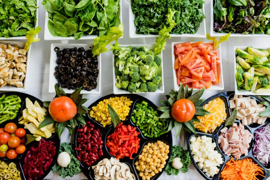 A healthy spread of fresh fruits, vegetables, and nuts serving as natural alternatives to prenatal vitamins.